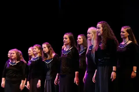 Contemporary choir performing on stage